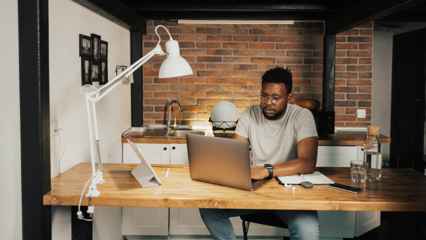 A person working on a laptop.